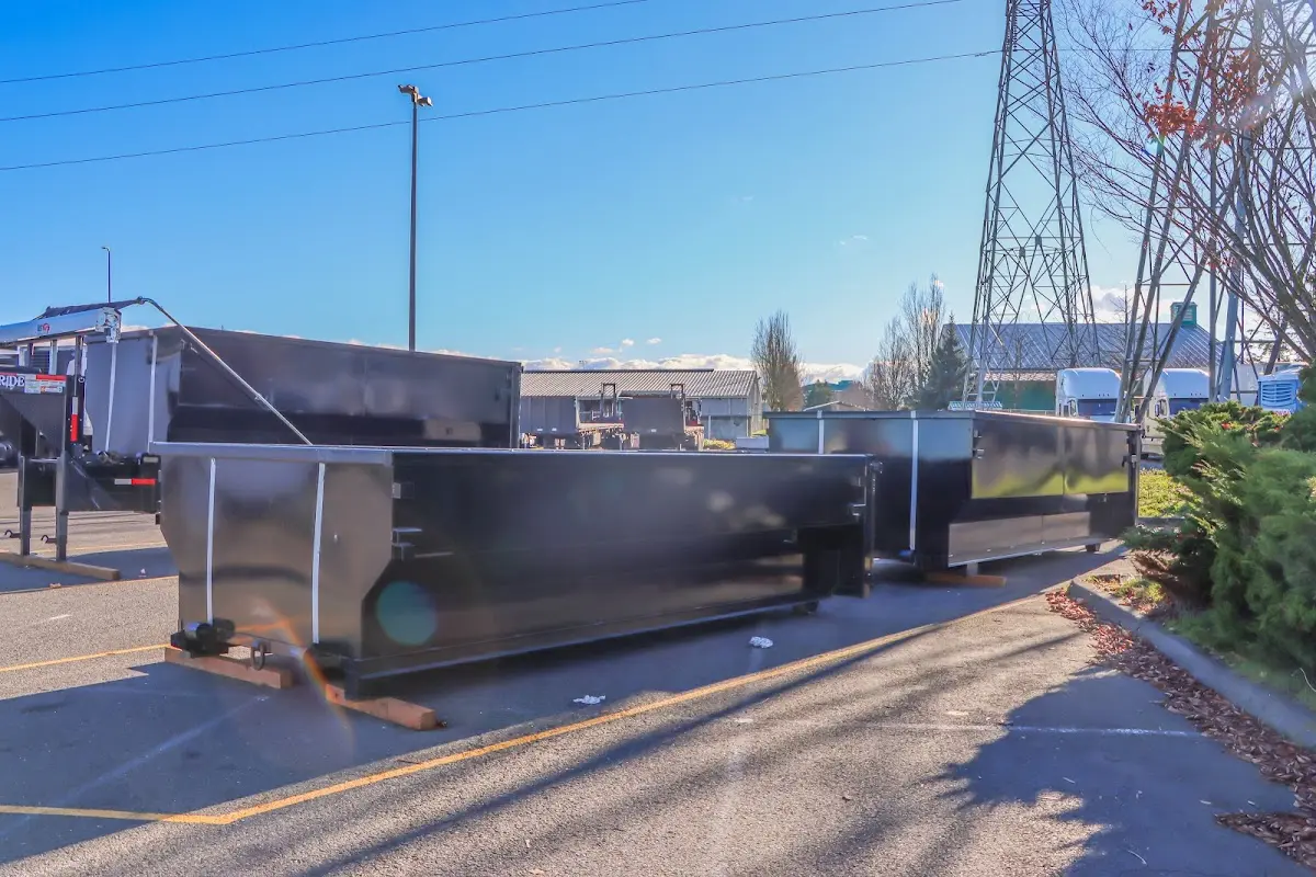 Roll-off dumpster ready for waste disposal at job site for 12 Yard Dumpster Rental in Corinth